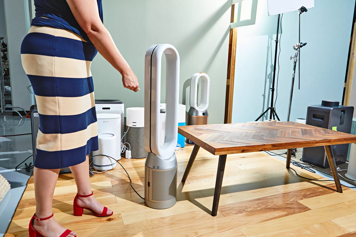 Person operating Dyson Purifier Cool Purifying Fan TP07 with a remote