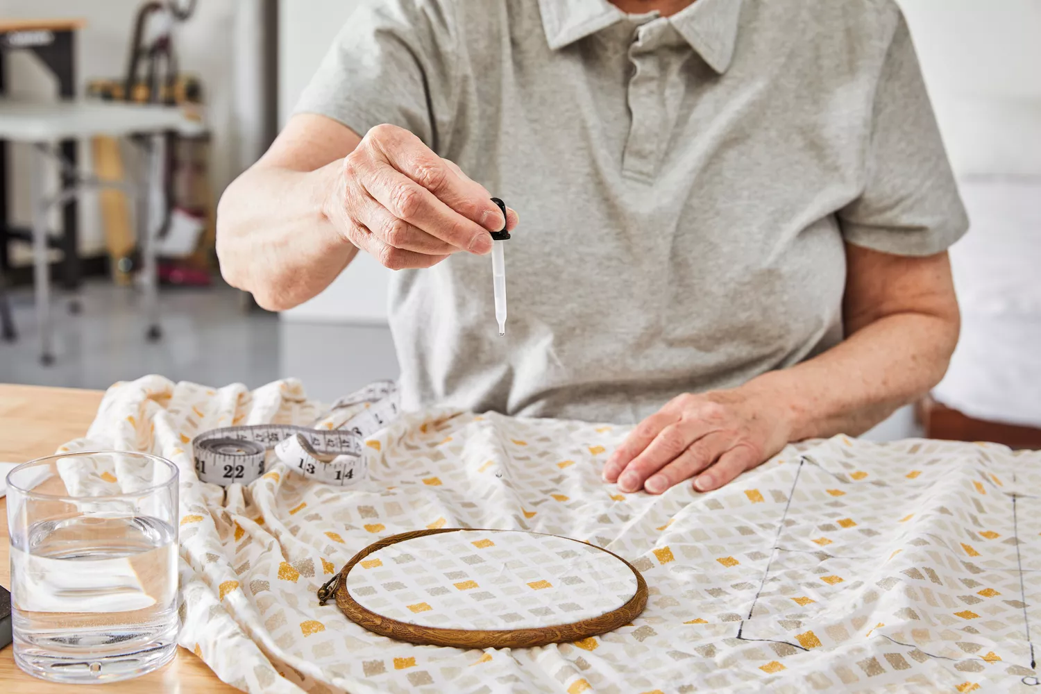 A person dropping water on the Feather & Stitch 100% Cotton Sheets