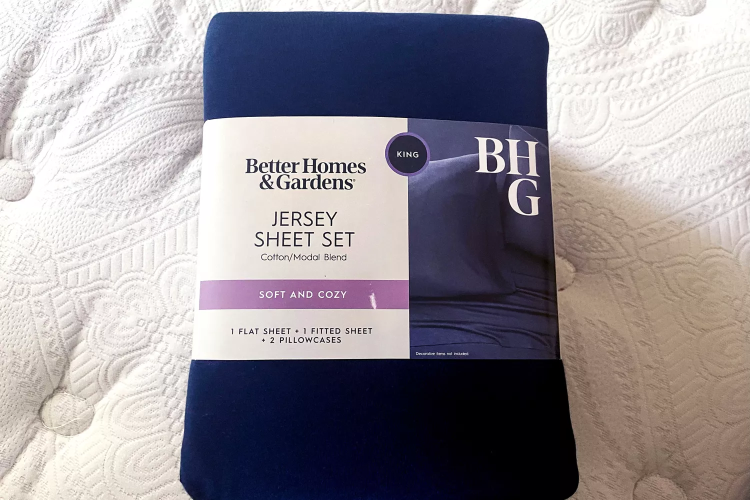 The Better Homes & Gardens 4-Piece Jersey Sheet Set in packaging
