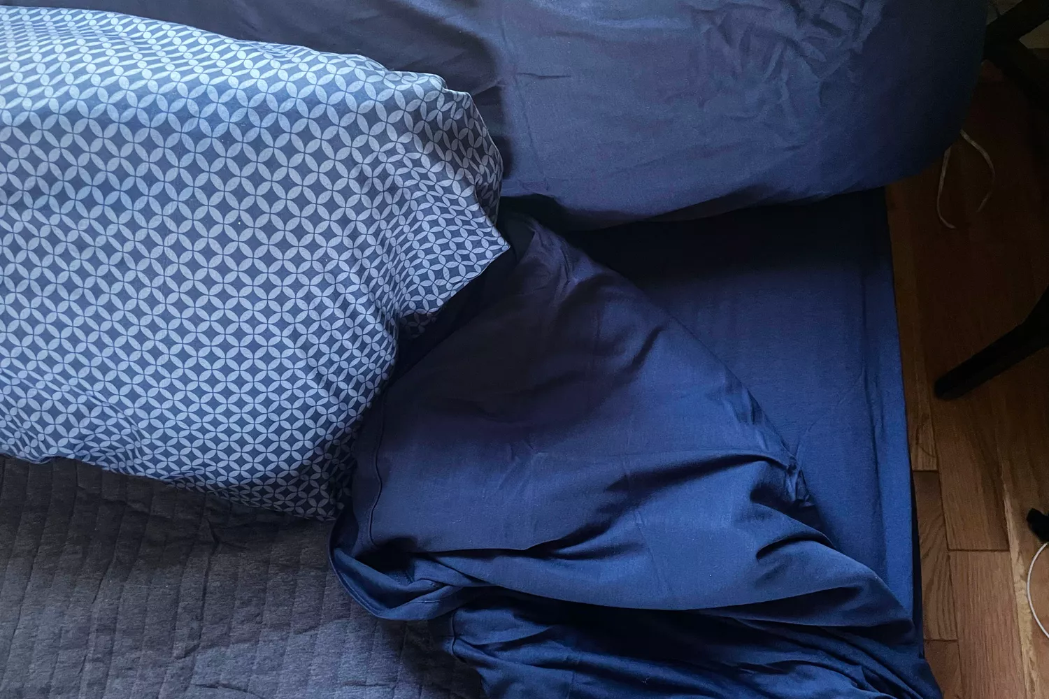 The Better Homes & Gardens 4-Piece Jersey Sheet Set on a bed